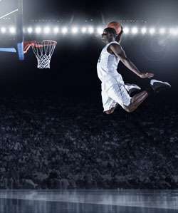 Basketball Player Dunking a Basketball During a Game