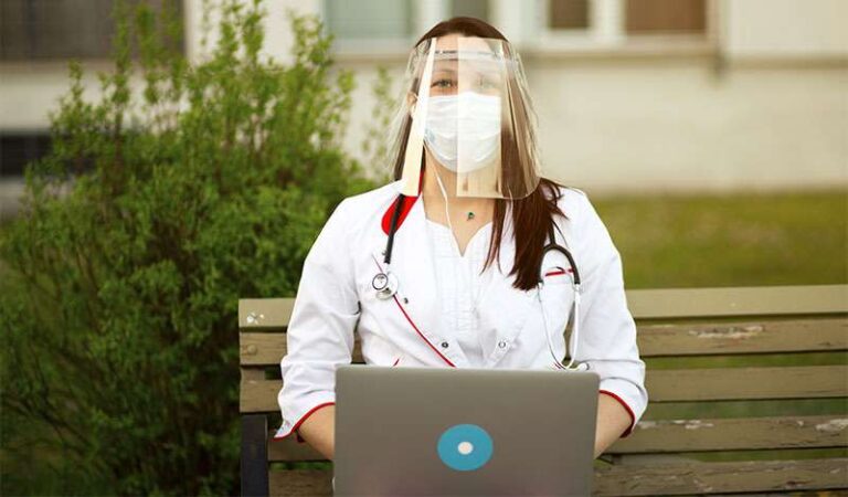 Doctor wearing face mask and face shield