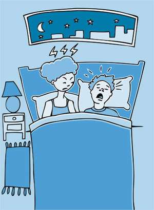 Husband snoring while frustrated wife tries to sleep