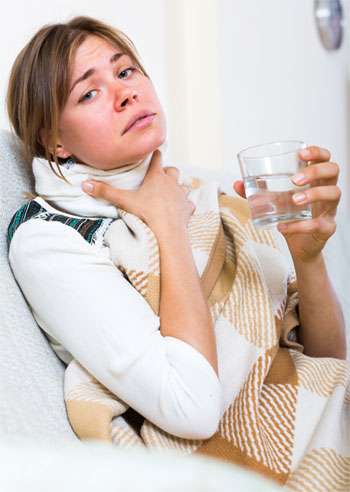 Woman with Symptoms of a Sore Throat