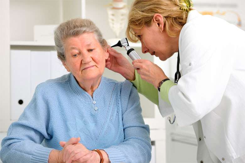 Senior woman with hearing loss and dementia